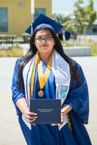 Image of Johanna F., Valedictorian and recipient of the Tsunami Award with her diploma
