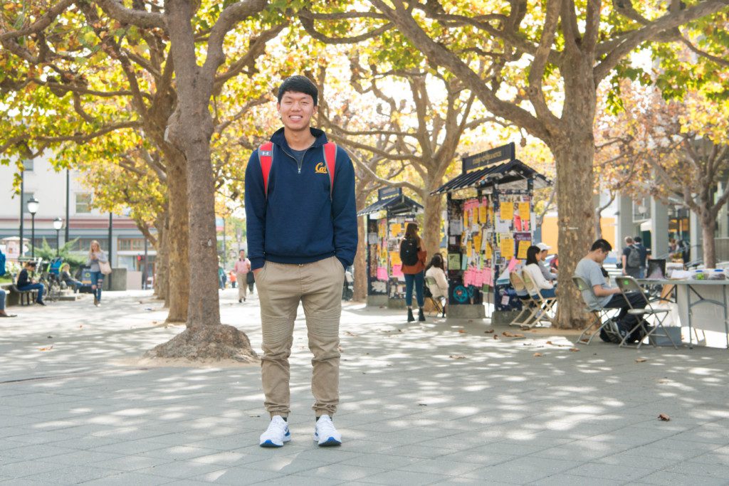 Student standing on UC Berkeley campus wearing Cal sweatshirt