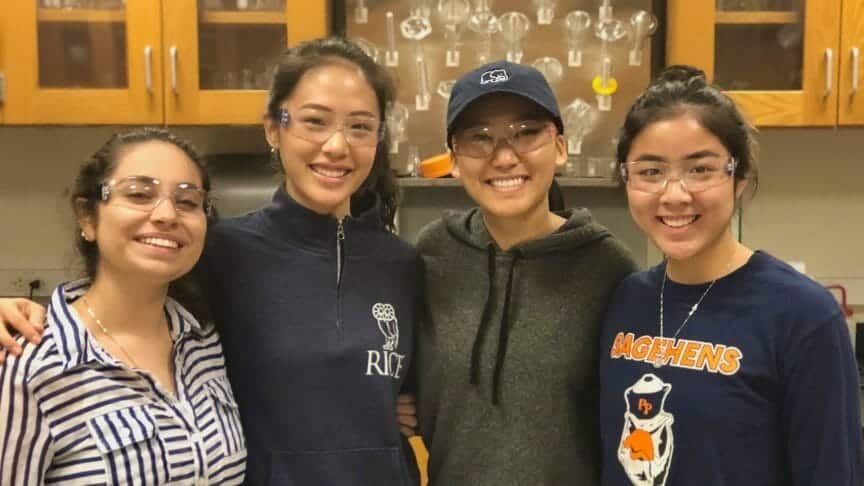 Photo of Yessenia in lab with college classmates