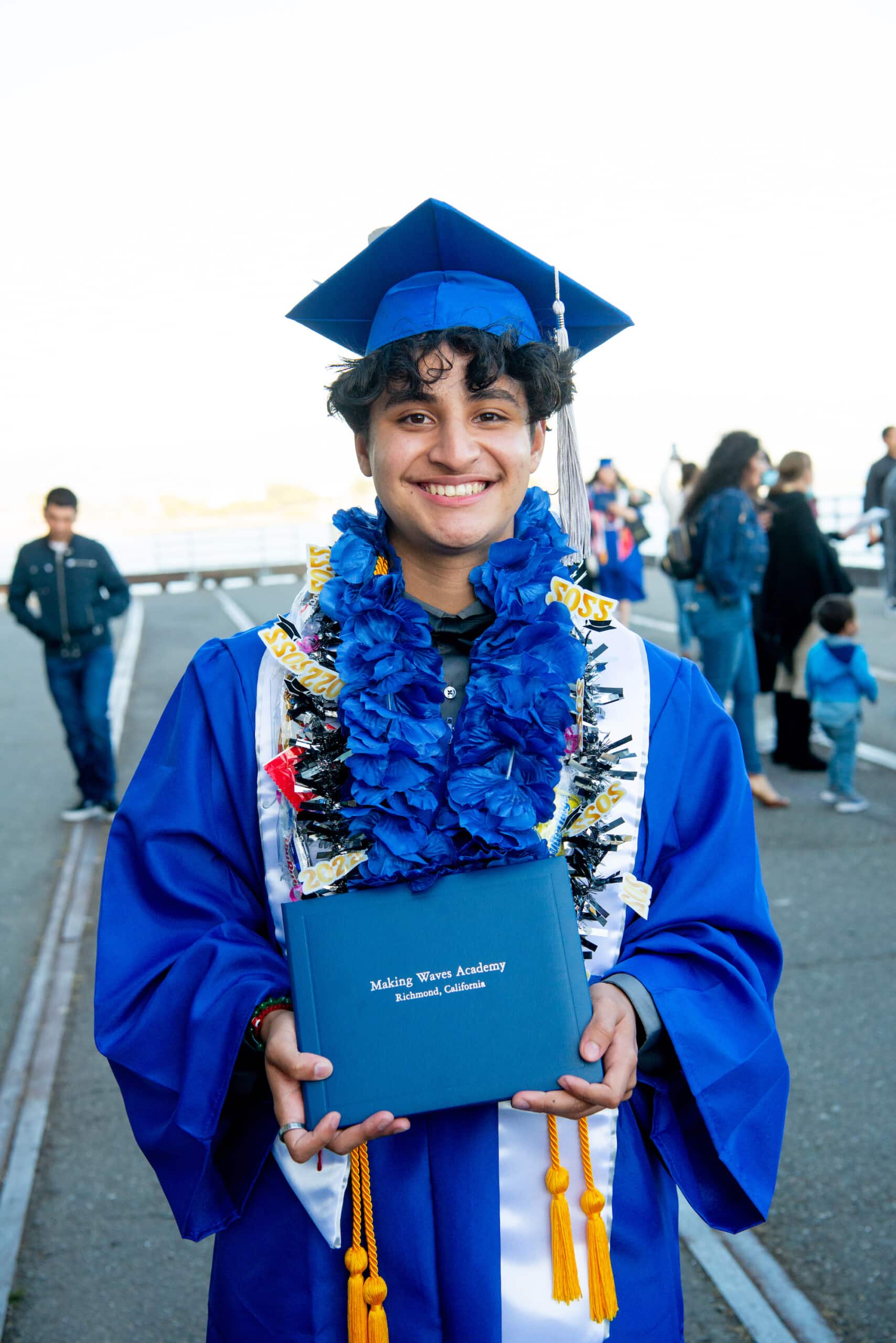 Student holding diploma at graduation