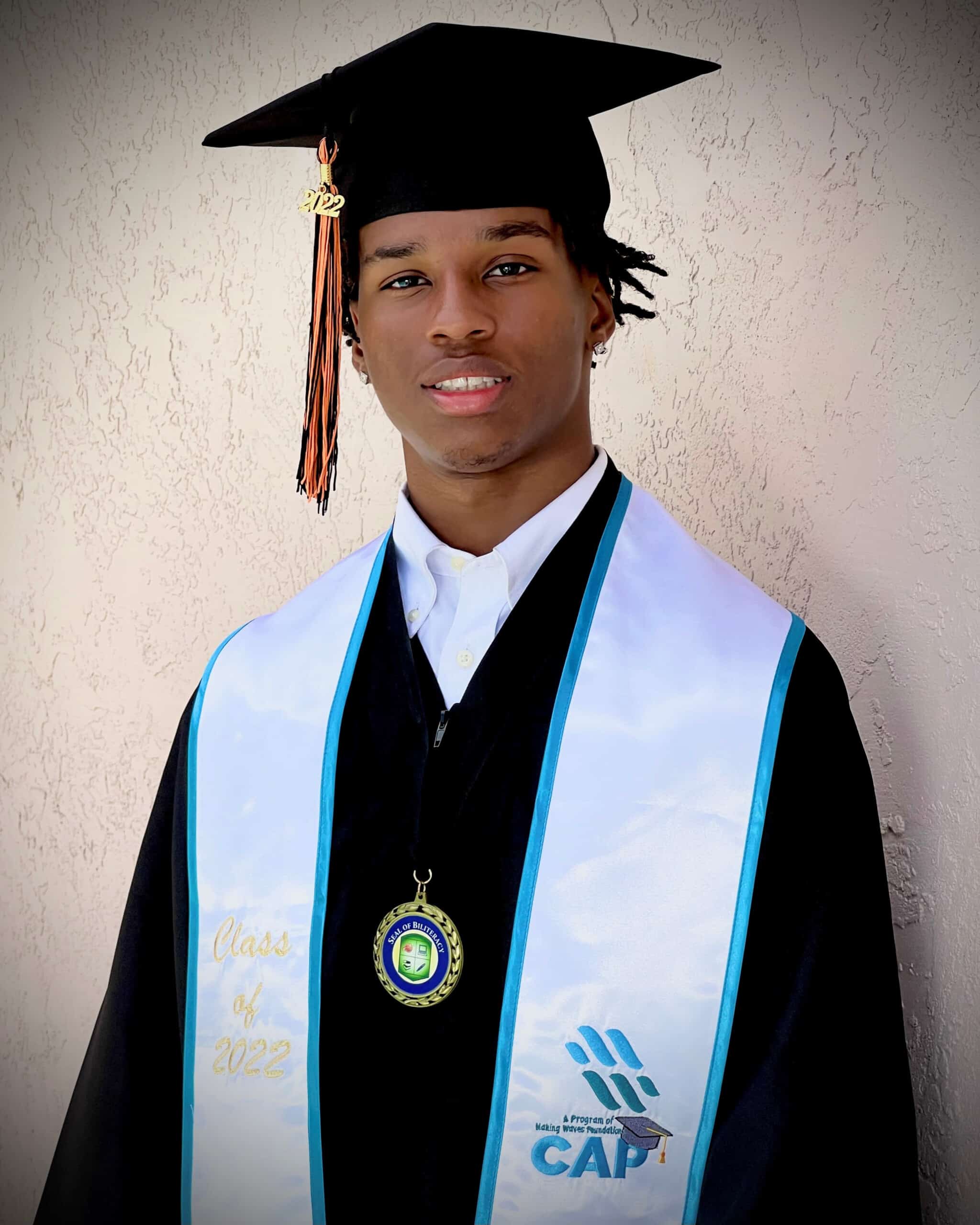 Brandon Williams in gap and gown at Pittsburg High graduation