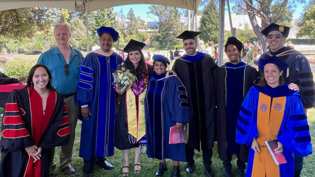 Alison Paxtor at Cal State East Bay graduation with faculty 