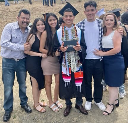 Anthony Gonzalez with his family at his little brother's graduation
