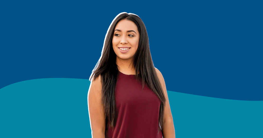 Photo of Angelica Delgado with a red shirt in a dark blue and blue background