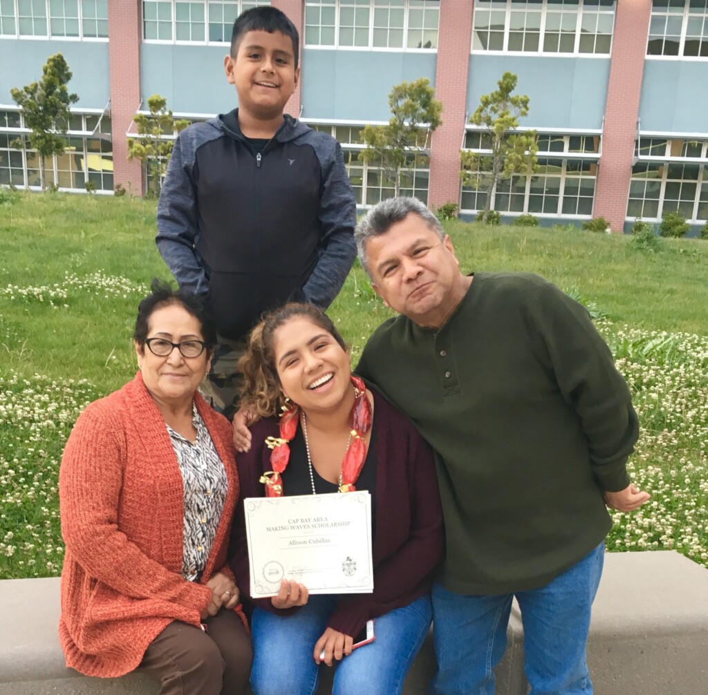 Photo of Allison Cubillas and family with Allison holding scholarship certificate
