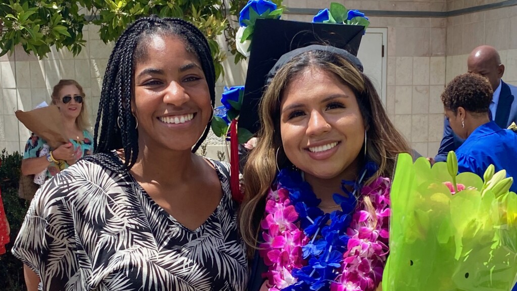 Photo of Allison Cubillas with her college coach Ayasha trip at graduation