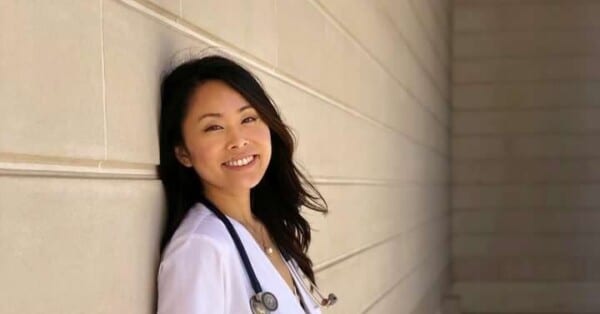 Grace Zhang in white coat with stethoscope