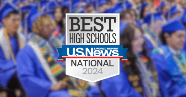 Photo of graduates behind a badge for Best High Schools from US News 2024