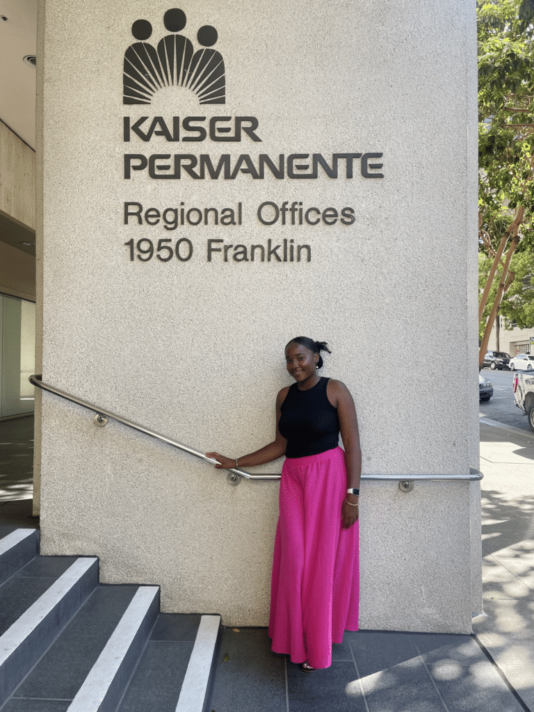 Photo of Edinna Obaseki outside a Kaiser Permanente office
