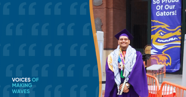 Photo of Abraham in purple grad gown in front of sign that says proud of gators