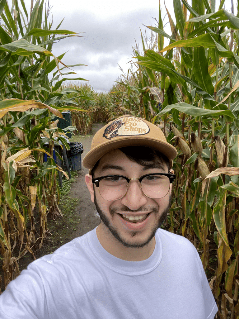 Estefan in corn field smiling